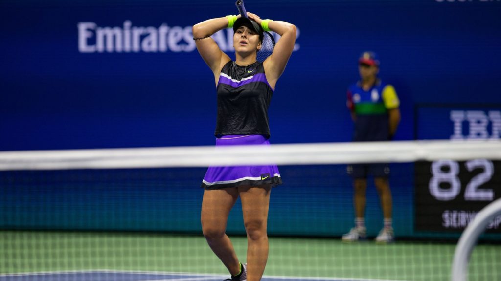 Bianca Andreescu puts her hands on her head in disbelief as she wins a match