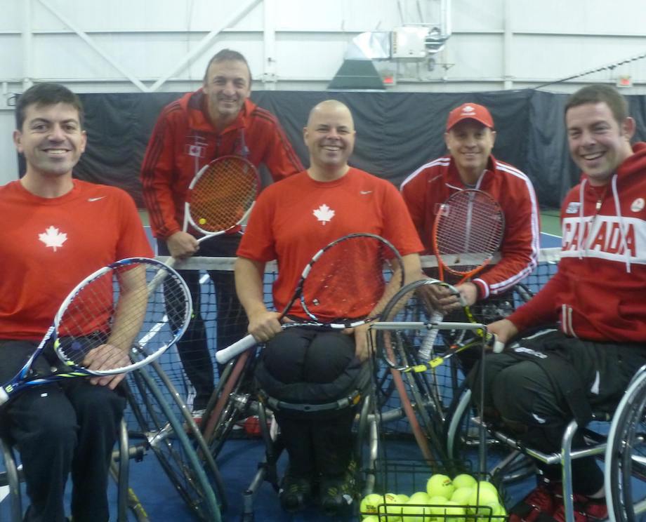 Group of weelchair tennis players and their coaches