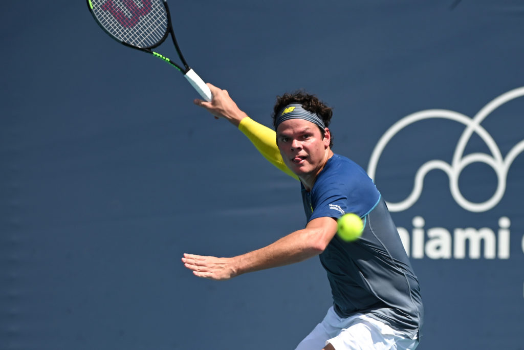 milos raonic hits a forehand at the miami open