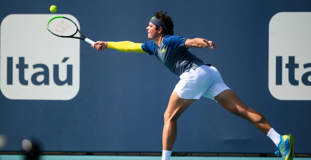Milos Raonic stretches for a forehand
