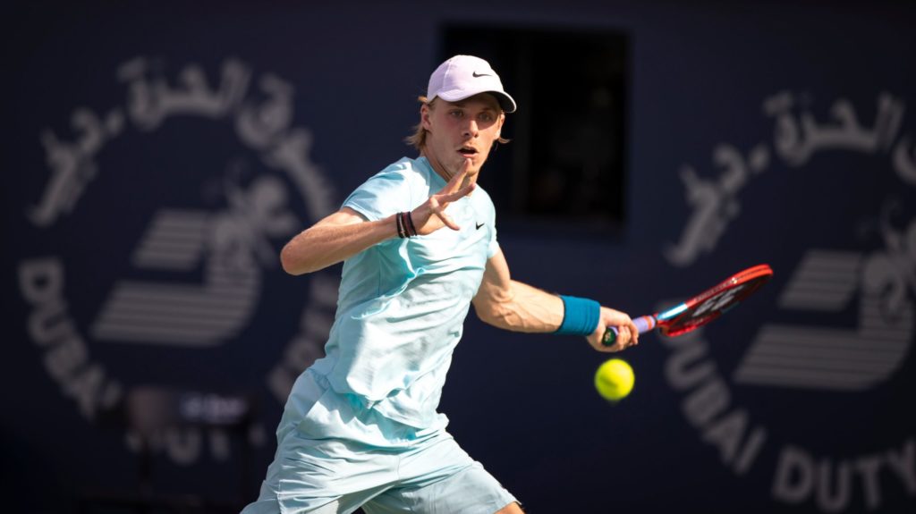 Denis Shapovalov looks at the ball and prepares to hit a forehand