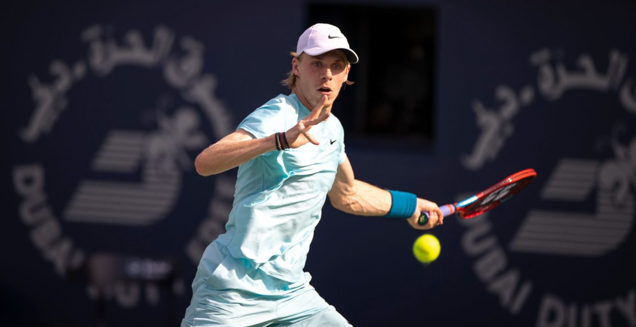 Denis Shapovalov looks at the ball and prepares to hit a forehand