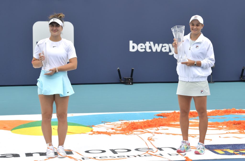 bianca andreescu and ashleigh barty hold their miami open trophies