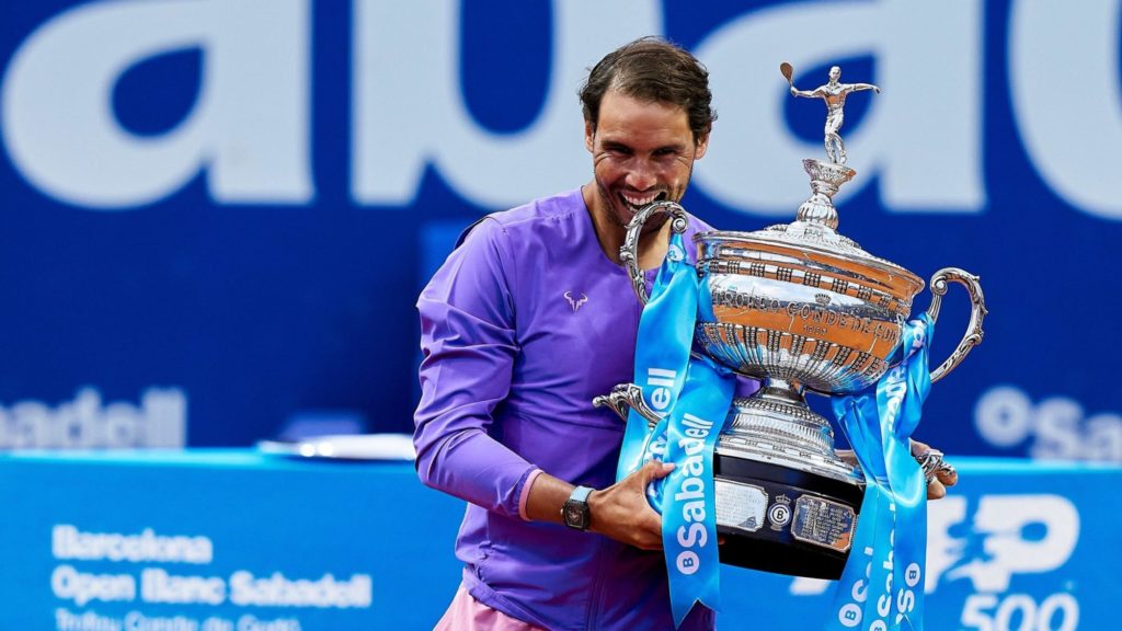 nadal holds the barcelona open trophy