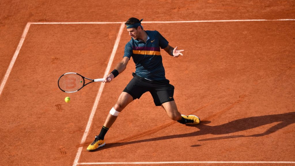 Juan Martin Del Potro slides on clay to hit a forehand