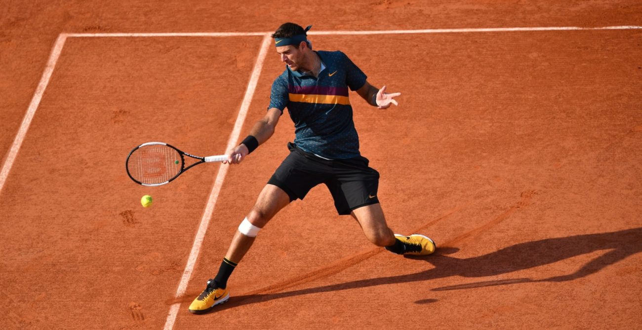 Juan Martin Del Potro slides on clay to hit a forehand