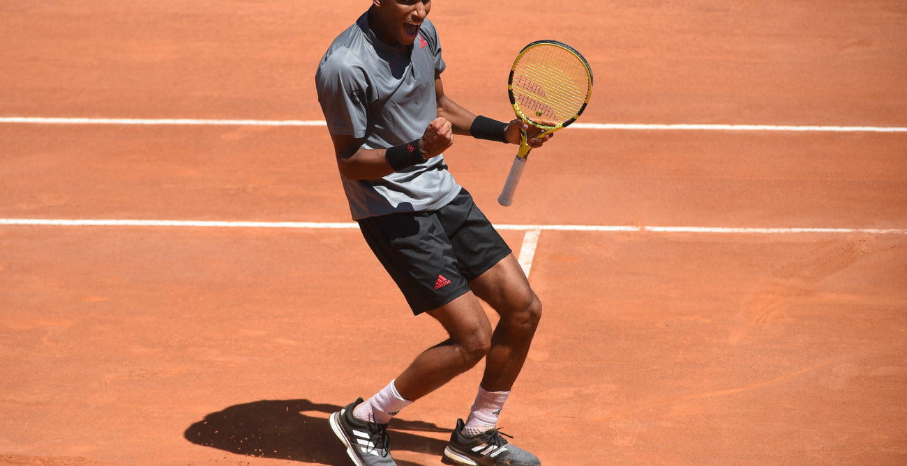 felix auger-aliassime pumps his fist at the Italian Open after winning a point