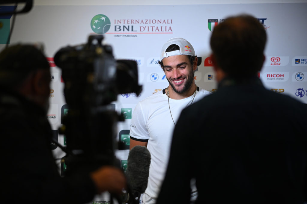 Matteo Berrettini smiles during a press conference