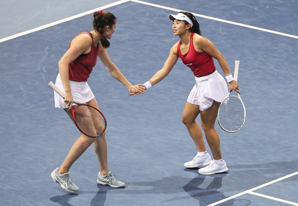 Rebecca Marino and Carol Zhao encourage each other during the billie jean king doubles match
