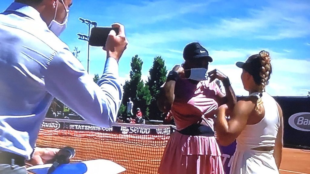 Lisa Pigato takes picture with Serena Williams on court