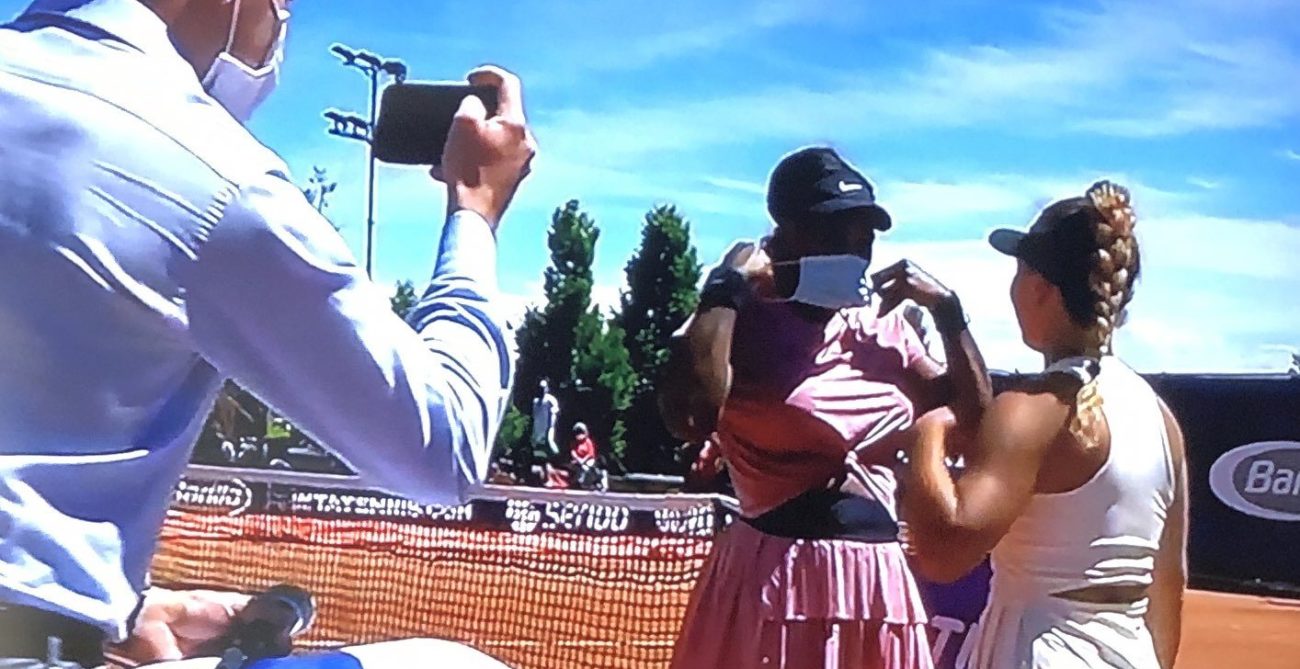 Lisa Pigato takes picture with Serena Williams on court