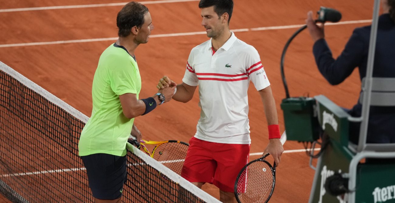 Novak Djokovic and Rafael Nadal shake hands at the net after their semi-final match