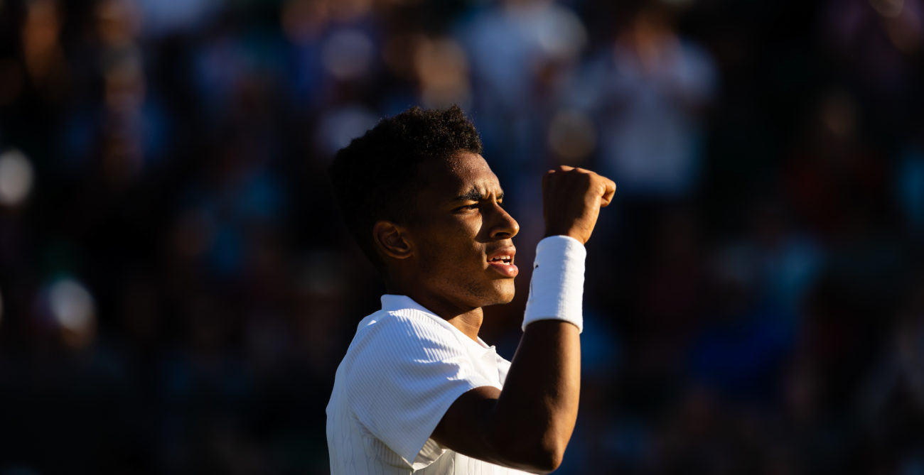 Felix Auger Aliassime raises his fist after a win at Wimbledon