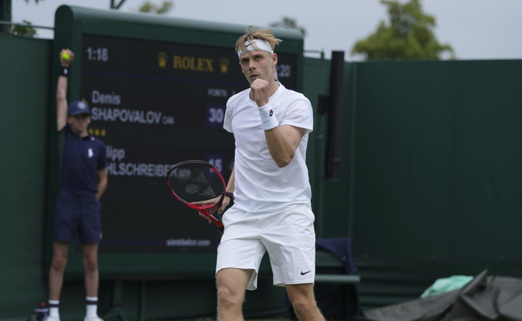 Denis Shapovalov pumps his fist at Wimbledon