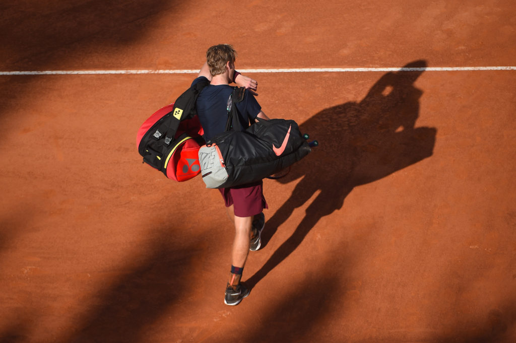 Shapovalov walks off court head low after a loss to Nadal in Rome