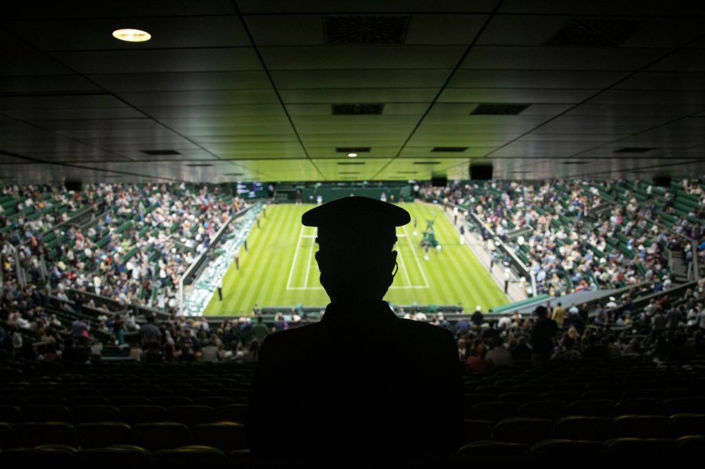 Silhouette of a person on a high section of the Centre Court Wimbledon