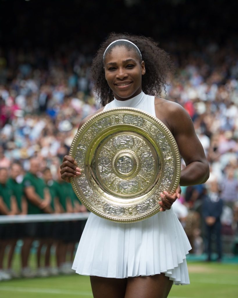 Serena WIlliams hold the Wimbledon trophy
