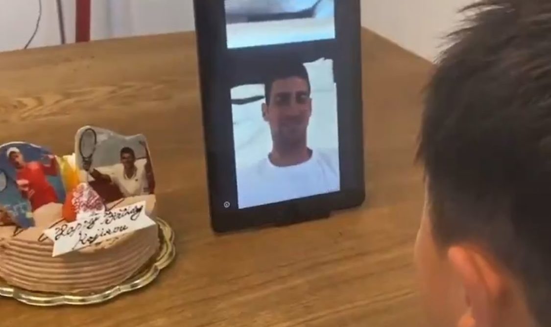 Djokvovic in a tablet screen wishing happy birthday to a Japanese kid