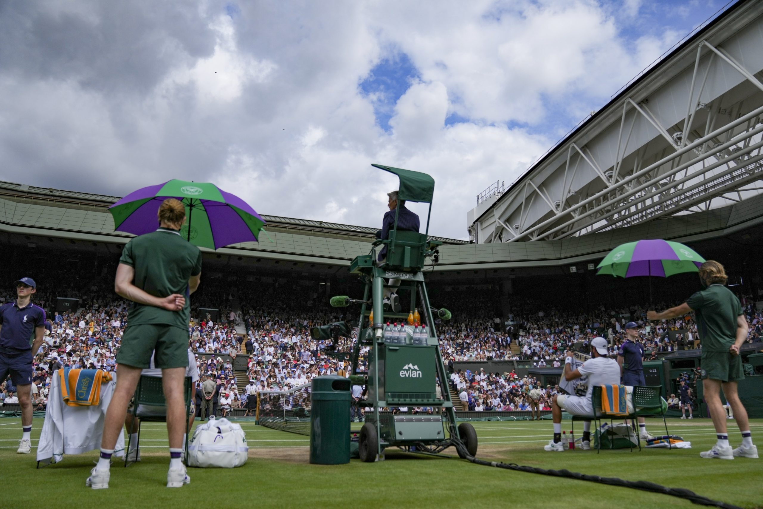 Centre Court wimbledon view of the back of the ball kids and the chair umpire during the final match