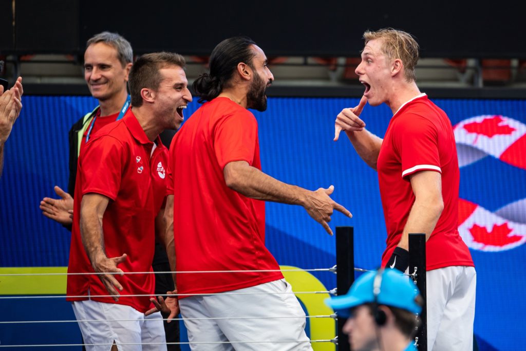 Denis Shapovalov jokes around with the Team Canada group at the ATP Cup during a match