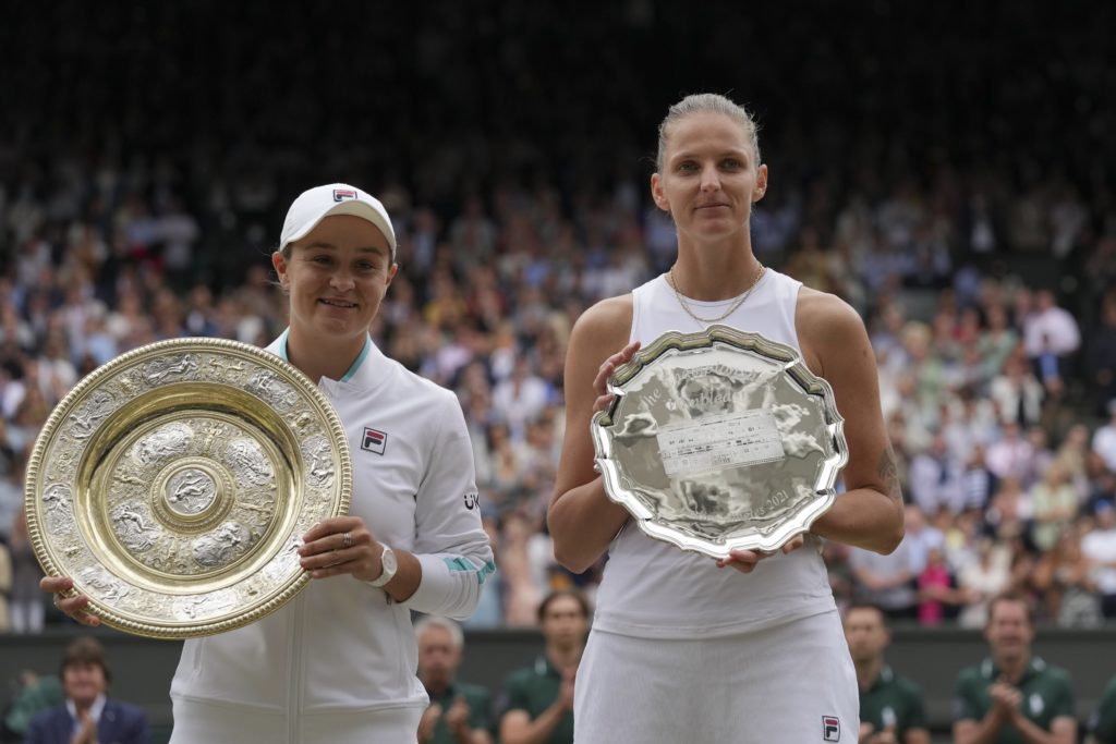 Ashleigh Barty and Karolina Pliskova pose with the Champion and Runner-up trophies respectively at Wimbledon