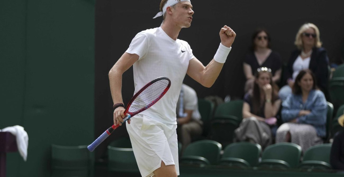 Denis Shapovalov pumps his fist at Wimbledon