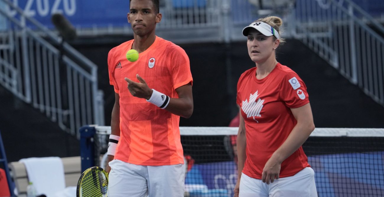 Felix Auger-Aliassime and Gabriela Dabrowski standing next to each other on court