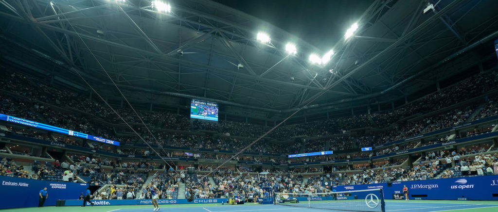 Arthur Ashe Stadium viewed from the ground during a night match
