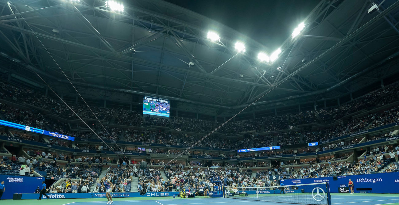 Arthur Ashe Stadium viewed from the ground during a night match