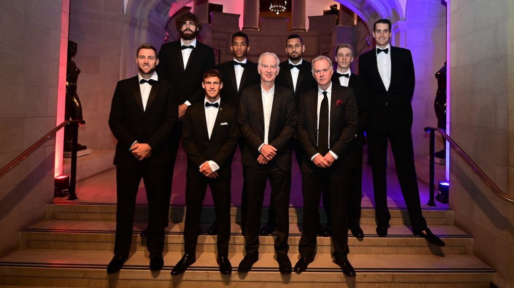 Tennis players in suits posing as a group