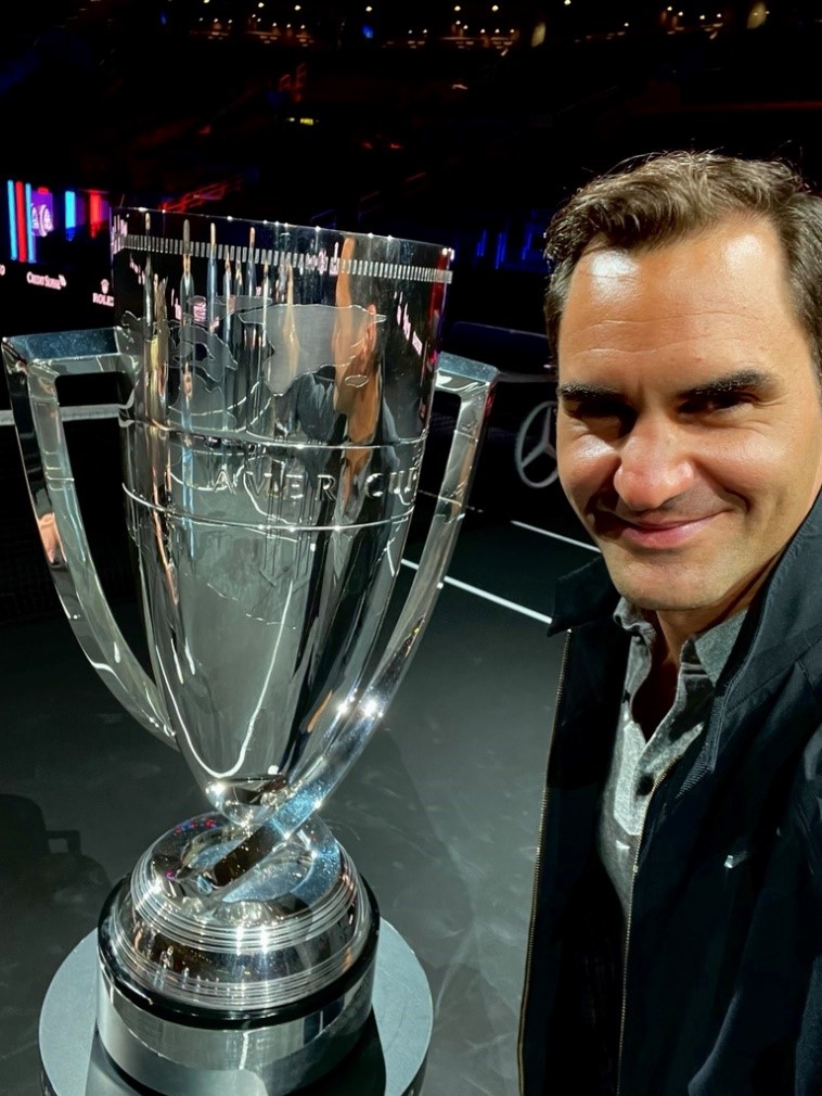 Roger Federer takes a selfie with the Laver Cup Trophy