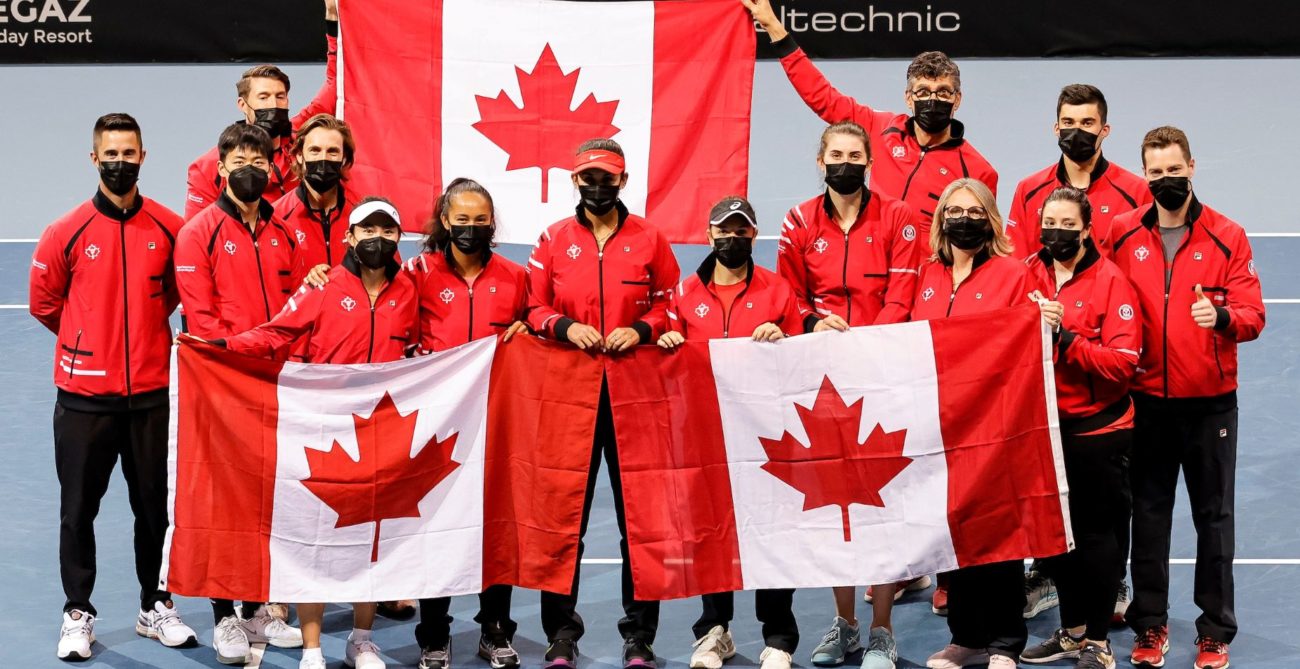 The Canadian Billie Jean King Cup team holds up Canadian flags