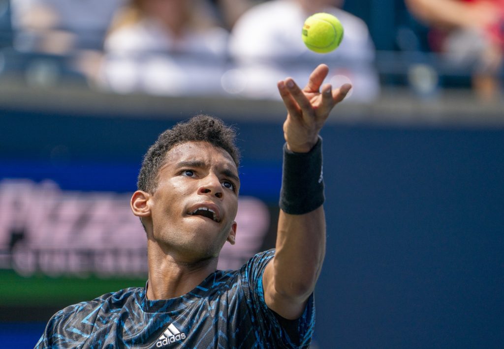 Felix Auger-Aliassime serves at the 2021 National Bank Open