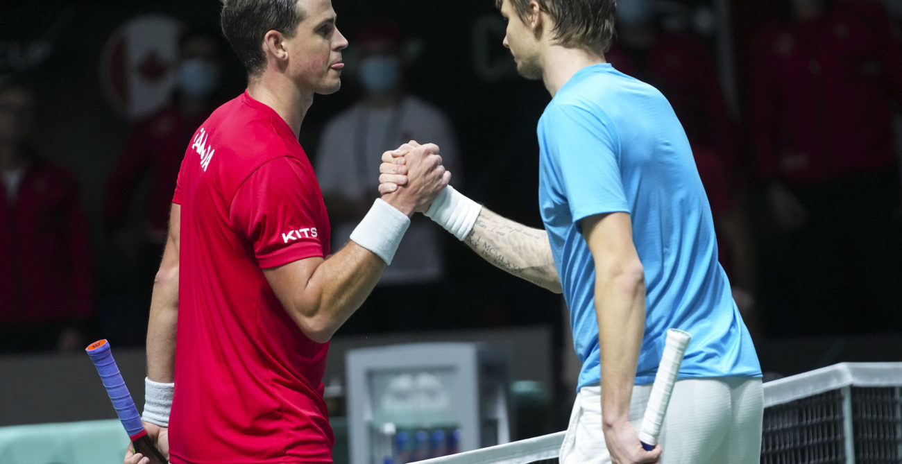 Vasek Pospisil and Alexander Bublik shaking hands at the 2021 Davis Cup Finals