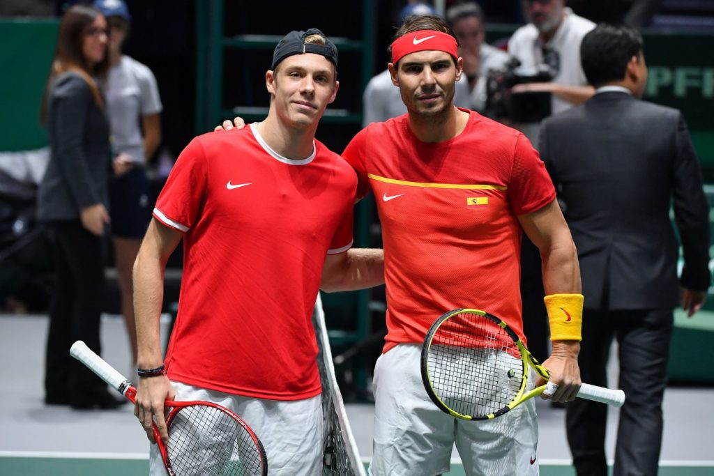 Shapovalov and Nadal take a picture at the net