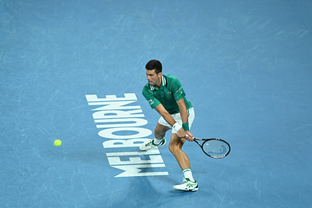 Novak Djokovic to hit a backhand over the Melbourne sign at the Australian Open