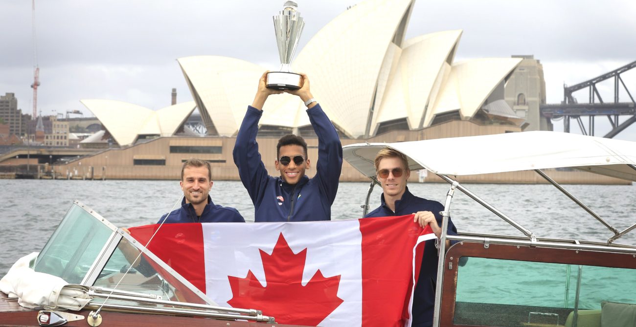 denis shapovalov felix auger-aliassime steven diez on boat with flag and trophy atp cup in sydney