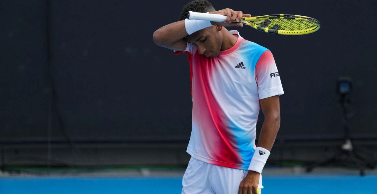 Felix Auger-Aliassime wipes his forehand