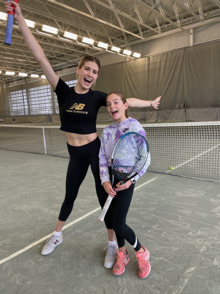 Genie Bouchard and Raphaelle Bruneau pose for a picture at the National Tennis Centre in Montreal