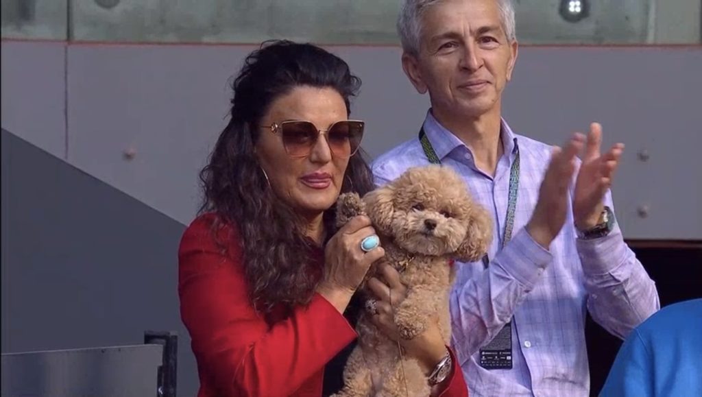 Maria Andreescu holds up Coco the Dog