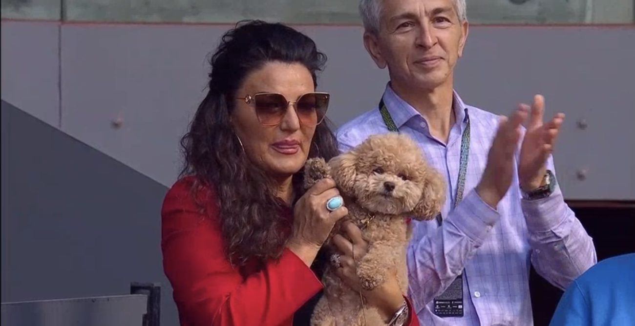 Maria Andreescu holds up Coco the Dog