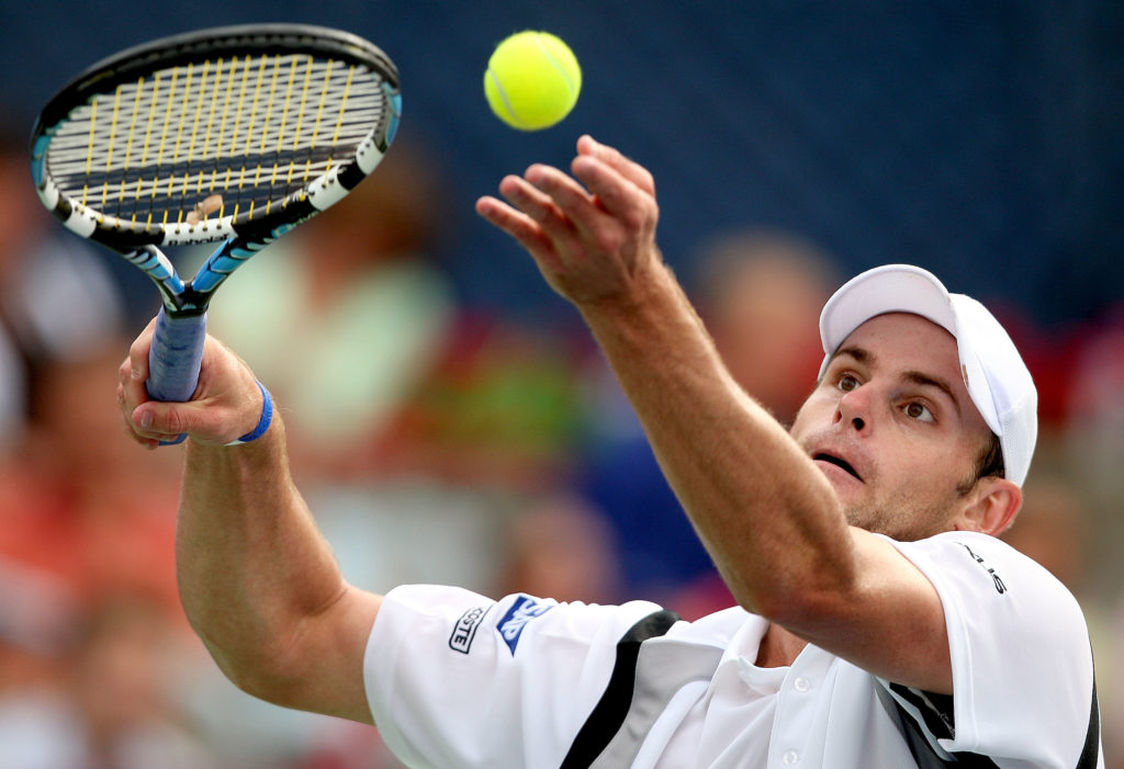 Andy Roddick tosses the ball up to serve