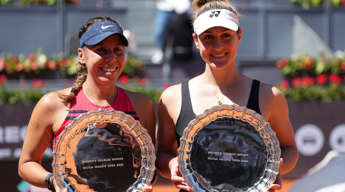 Giuliana Olmos and Gabriela Dabrowski hold their Madrid trophies.