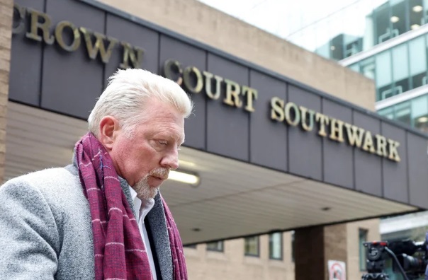 Boris Becker in front of a courthouse looking down