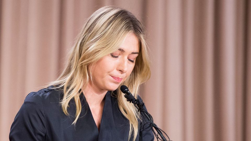 Maria Sharapova looking down in a press conference