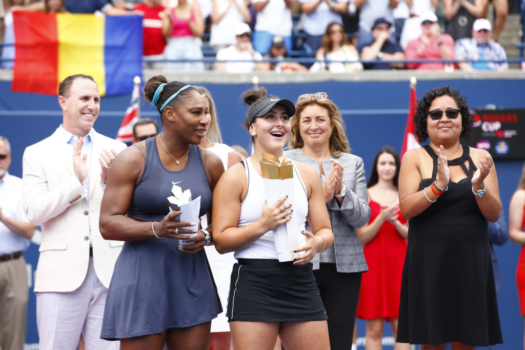 Serena Williams and Bianca Andreescu hold their trophies.