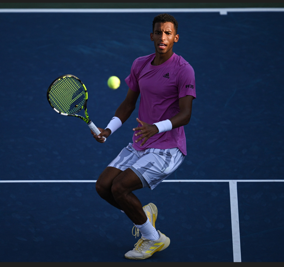 Auger-Aliassime at the net