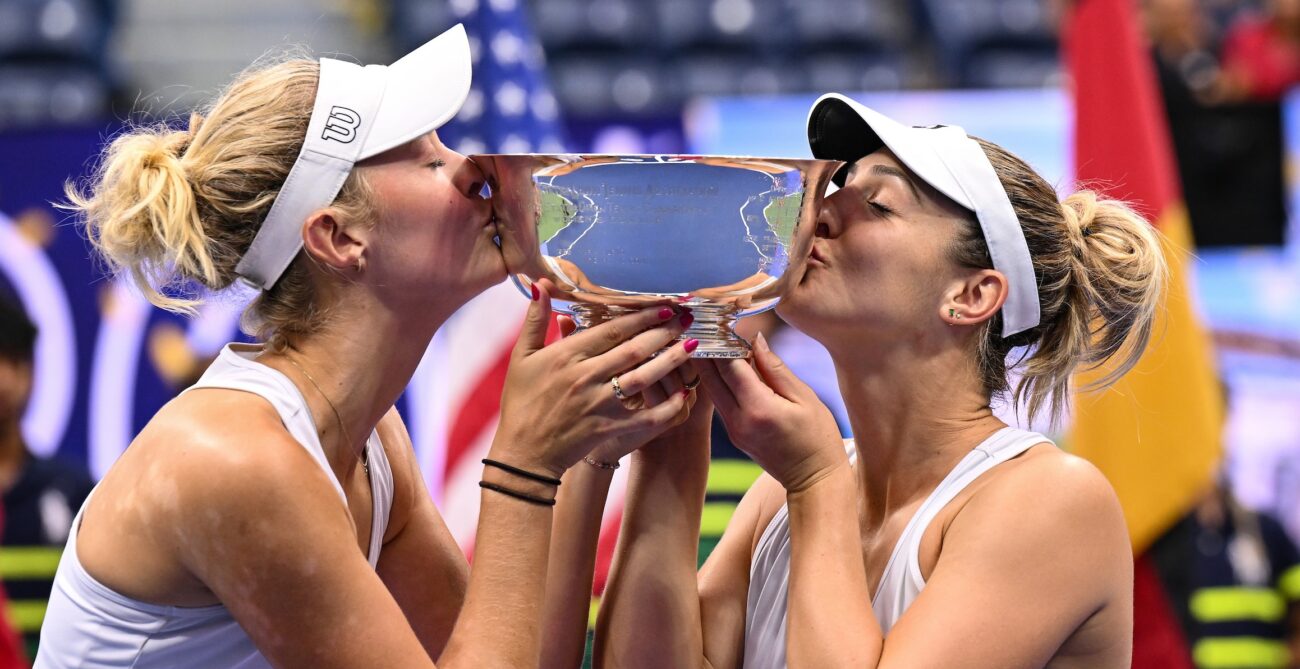 Erin Routliffe (left) and Gabriela Dabrowski kiss the US Open trophy.