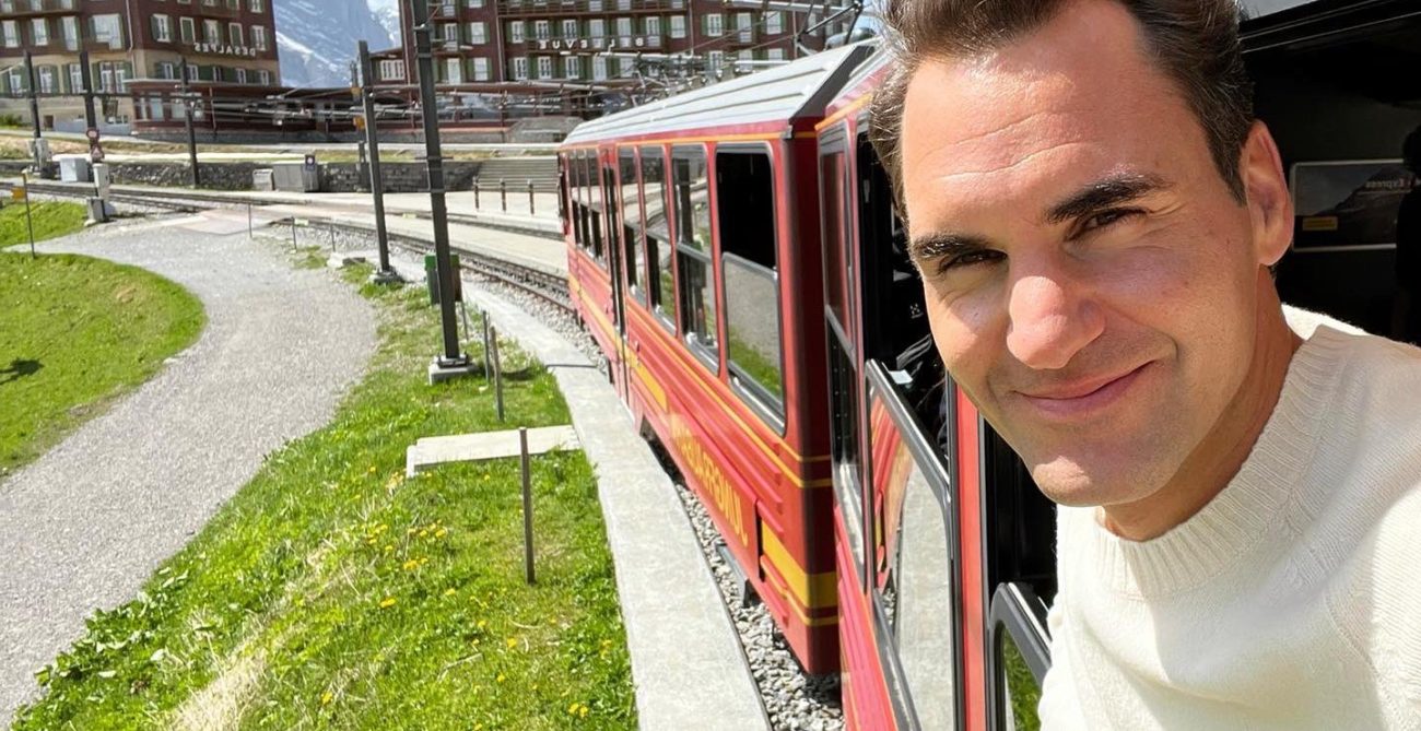 Roger Federer on a train in a sunny day in Switzerland