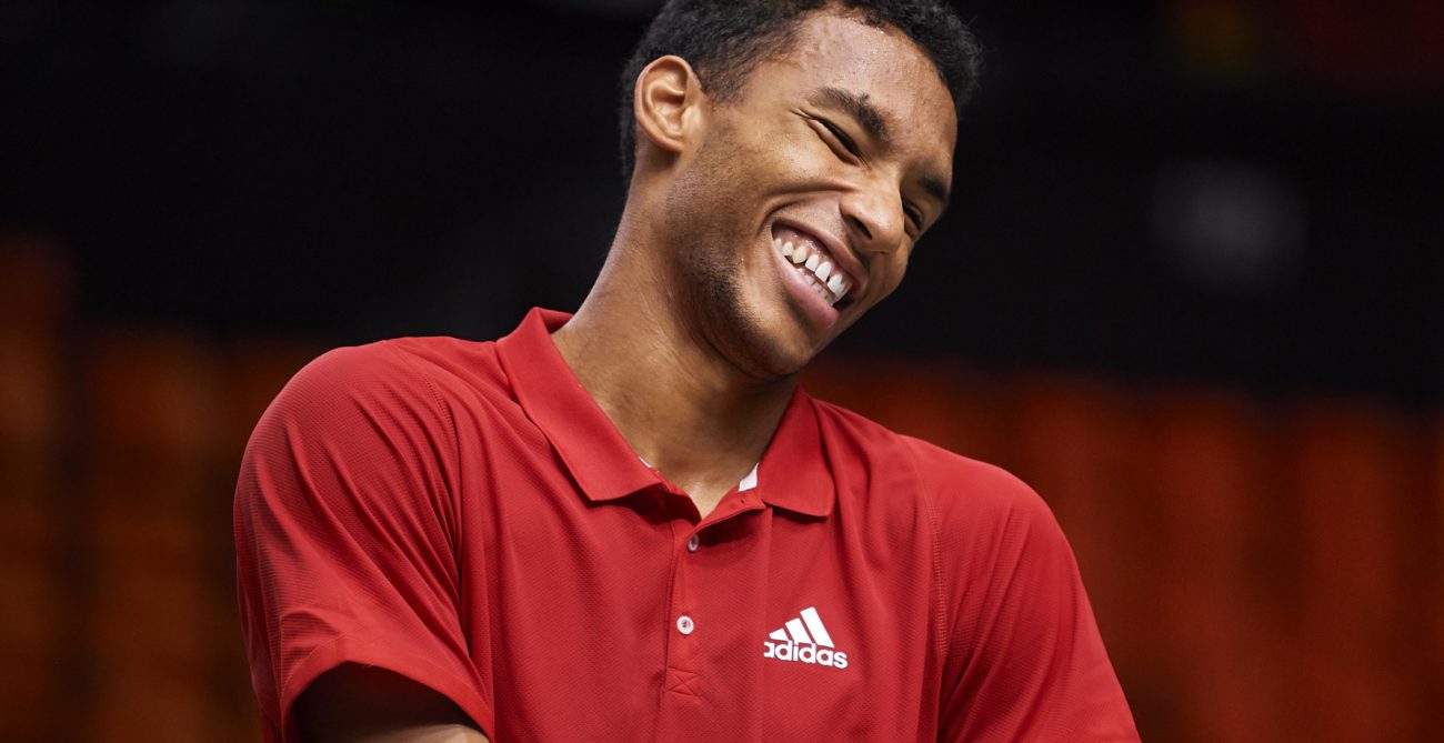 Felix Auger-Aliassime smiles during a practice